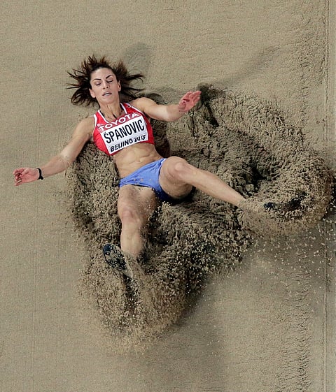 Athletes Landing in Pit During Long Jump Qualification at World Athletics Championships