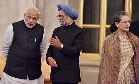 Prime Minister Narendra Modi and former PM Manmohan Singh with Sonia Gandhi in the background at Rashtrapati Bhavan. (File Photo | PTI)