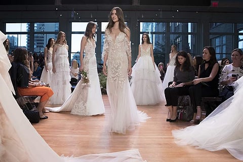 The Monique Lhuillier bridal collection is modeled during bridal fashion week in New York. Her collection involved several intricate lace designs. (Photo | AP)