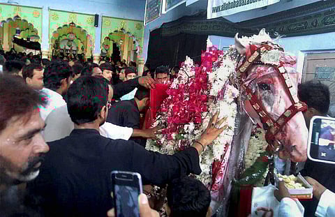 Muslim devotees offering prayers during procession on Muharram in Allahabad on Wednesday | PTI