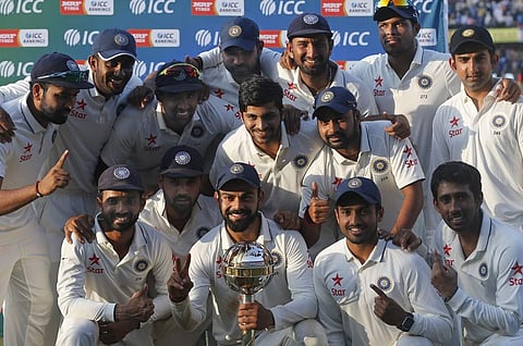 The Indian cricket team poses for photographs with the ICC Test Championship mace at the end of their third test cricket match against New Zealand in Indore. (Photo | AP)