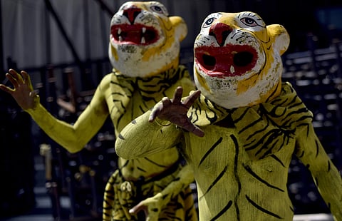 Artistes performing at Alai Balai during Dasara; (below) an artiste awaiting her performance at an event at Nampally in Hyderabad on Wednesday  | vinay madapu