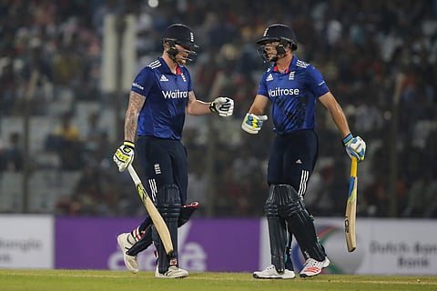 England’s captain Jos Buttler, right, and teammate Ben Stokes celebrate a boundary shot during the third one-day international cricket match against Bangladesh. | AP