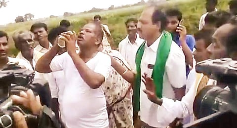 A screen shot of the video in which the farmer pretends to consume pesticide.