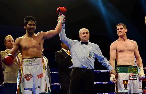 Star Indian boxer Vijender Singh celebrates after beating Australia's Kerry Hope and won the WBO Asia Pacific Super Middleweight Championship at Thyagaraj Sports Complex in New Delhi on Saturday. |PTI