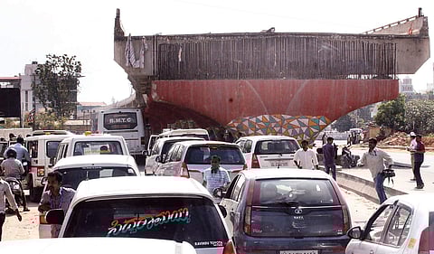 The incomplete flyover looms over a traffic jam in Hennur  Manjunath S