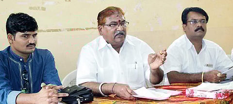 RTI activist Bhimappa Gadad (centre) addressing a press conference in Belagavi on Saturday.