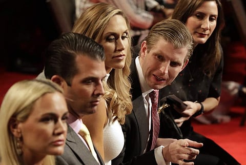 Donald Trump's sons Eric Trump and Donald Trump Jr. speak as the third debate progressed. (Photo | AP)