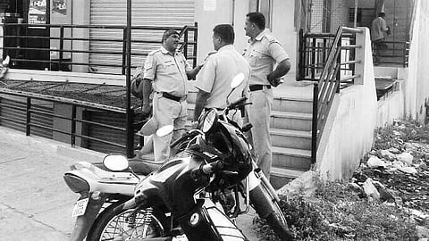 Police officials outside the firm’s office at Mariyappanapalya on Outer Ring Road in Bengaluru on Friday