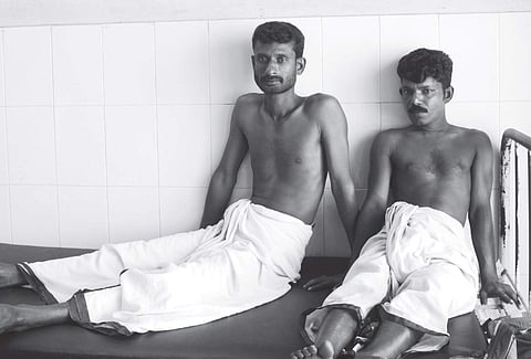 Rajeev and Shibu, who were allegedly subjected to third-degree torture, undergoing treatment at Kollam District Hsospital | Express