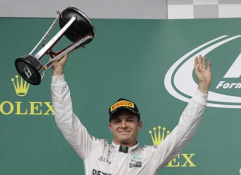 Mercedes driver Nico Rosberg, of Germany, celebrates after finishing second in the Formula One U.S. Grand Prix auto race at the Circuit of the Americas. | AP