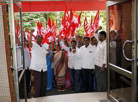 Members of Telangana Tourism Corporation Employees Union raising slogans at the Telangana Tourism House at Himayat Nagar in Hyderabad on Sunday | sathya keerthi