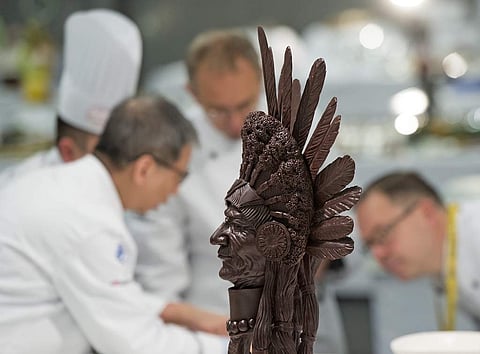 Jury members stand behind a chocolate creation by the Canadian national team. (Photo | AP)