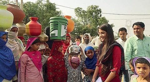 Sia Bishnoi with the villagers of Ferozepur Meo