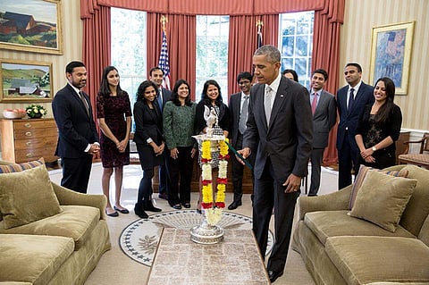 US President Barack Obama celebrated Diwali by lighting the first-ever diya in the Oval Office of the White House. |Facebook page of The  White House