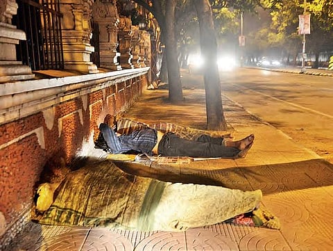 People sleeping in front of Indira Park In Hyderabad on Monday| r satish babu