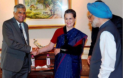 Congress President Sonia Gandhi greets Sri Lankan Prime Minister Ranil Wickremesinghe as former Prime Minister Manmohan Singh looks on during their meeting in New Delhi on Wednesday. | PTI