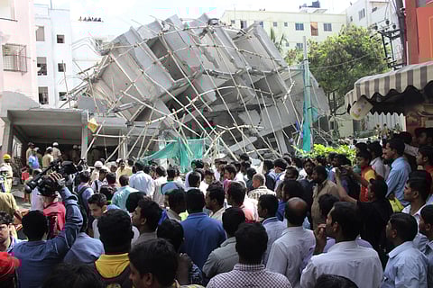 Public gathered in front of building collapsed at Bellandur in Bengaluru.  (File | EPS)