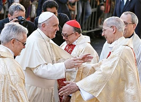 (Left) Pope Francis greets Fr. Adolfo Nicolas, superior general of the Society of Jesus, in Rome