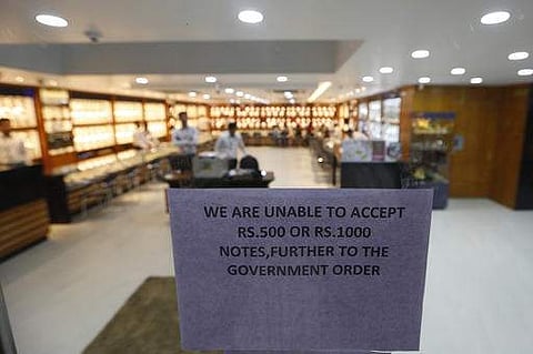 A notice is pasted on an entrance of a jewellery show room in Ahmadabad, India, Wednesday, Nov. 9, 2016. (Photo | AP)