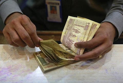 A cashier counts Indian rupee currency notes inside a bank in Mumbai August 5, 2013. | (File Photo | Reuters)