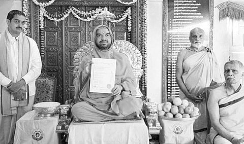 Raghaveshwara Bharati Swami of Ramachandrapura Mutt with the certificate