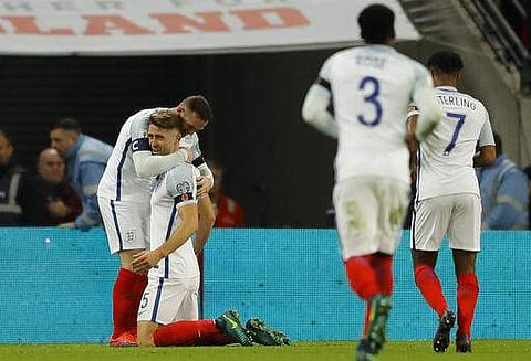 England's Gary Cahill, second left, is congratulated by teammate England's Wayne Rooney, right, after he scored his side's third goal of the game during the World Cup 2018. (Photo | AP)