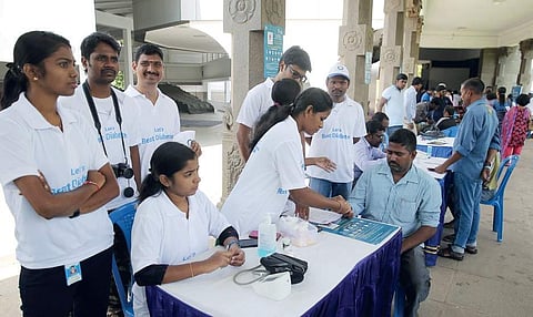 A medical checkup organised by Apollo Sugar Clinic; (right) Dr Shantaram, chief guest