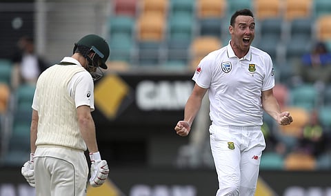 South Africa's Kyle Abbott, right, celebrates after taking the the wicket of Australia's Adam Voges, left, during their cricket test match in Hobart, Australia, Tuesday, Nov. 15, 2016. | AP