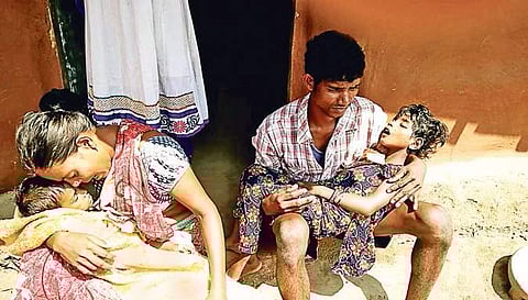 File photo of a grieving parent after death of their two daughters in Katanpalli village of Malkangiri district | Express