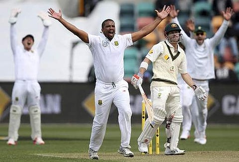 South Africa's Vernon Philander, second left, and teammates appeal for a lbw on Australia's David Warner, second right, during their cricket test match in Hobart, Australia.  | AP
