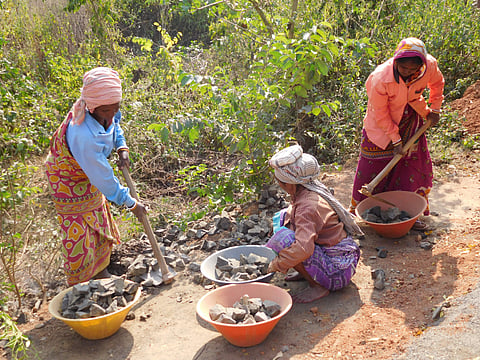 Women labourers work on credit for the construction of the tarred road in Bhadutola in Paschim Medinipur district on Thursday | Aishik Chanda