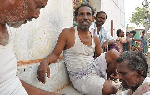 Satyanarayana explains his problems after demonetisation of Rs 1000 and Rs 500 notes at Gangapalem village. | (Ravindra Babu/EPS)