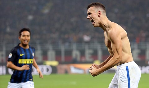 Inter Milan's Ivan Perisic celebrates after he scored during a Serie A soccer match between AC Milan and Inter Milan, at the San Siro stadium in Milan. | AP