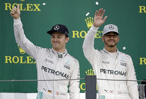 Hamilton (R) has won the last three races to move to within 12 points of his Mercedes teammate Rosberg. | AP