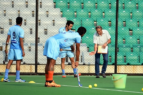 India men's hockey team chief coach Roelant Oltmans (R) along with the Indian players. |AFP