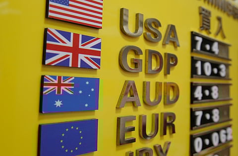 A board showing currency exchange rates at a money exchange store in Hong Kong. (File photo | AP)