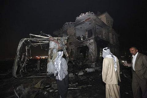 Civilians search for survivors in the rubble at the scene of a car bomb attack about 95 kilometers south of Baghdad on November 24. (Photo | AP)