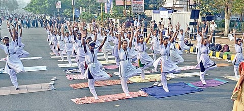 File photo of school girls performing Yoga on Janpath on the occasion of “Raahgiri Day” in Bhubaneswar | Express