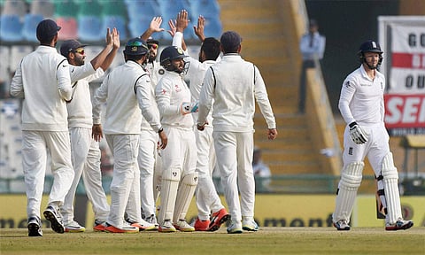 Indian players celebrate the dismissal of England batsman Gareth Batty on the fourth day of the third Test match between India and England in Mohali on Tuesday. | PTI