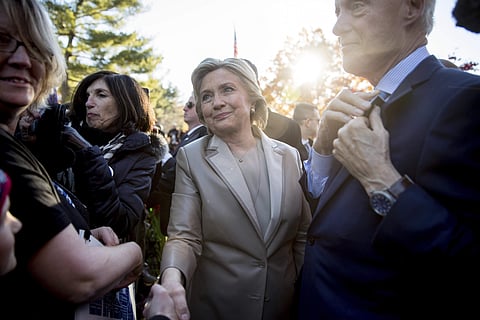 Democratic presidential candidate Hillary Clinton, accompanied by her husband, former President Bill Clinton. | AP