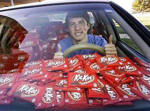 Hunter Jobbins with his Kit Kat bars. (Photo | AP)