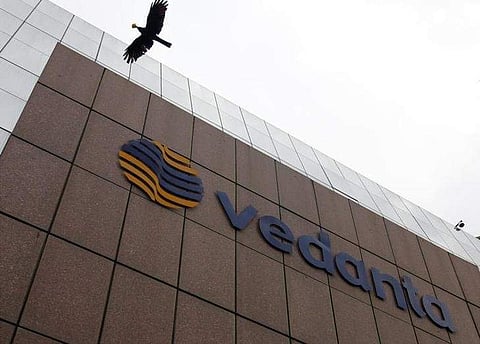 A bird flies by the Vedanta office building in Mumbai August 16, 2010. | Reuters