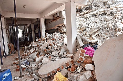 NDRF personnel clearing the debris of the seven-storey building that collapsed on Thursday night at Nanakramguda in Hyderabad | Vinay madapu