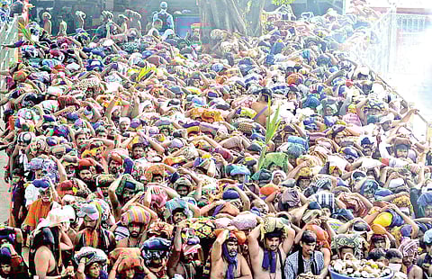 The long queue of pilgrims at lower thirumuttom of Sabarimala Lord Ayyappa temple on Tuesday | SHAJI VETTIPURAM