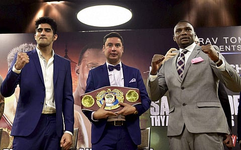 Vijender Singh L with Francis Cheka, current intercontinental Champion, during a news conference ahead of their fight in New Delhi. (PTI)