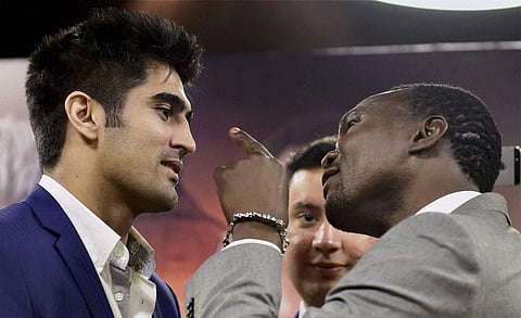Vijender Singh and his opponent from Tanzania Francis Cheka face off before their fight on December 17. (PTI)