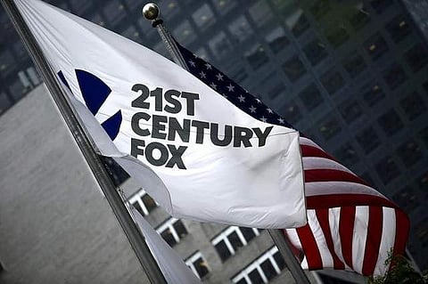 The flag of Twenty-First Century Fox Inc is seen waving at the company headquarters in New York. (File photo | Reuters)