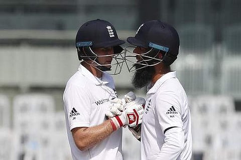 England's Joe Root, left, congratulates Moeen Ali after scoring half century during their first day of the fifth cricket test match against India in Chennai. (Photo | AP)