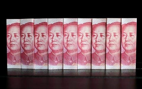 Chinese 100 yuan banknotes are seen in this picture illustration taken in Beijing July 11, 2013. (Photo | Reuters)